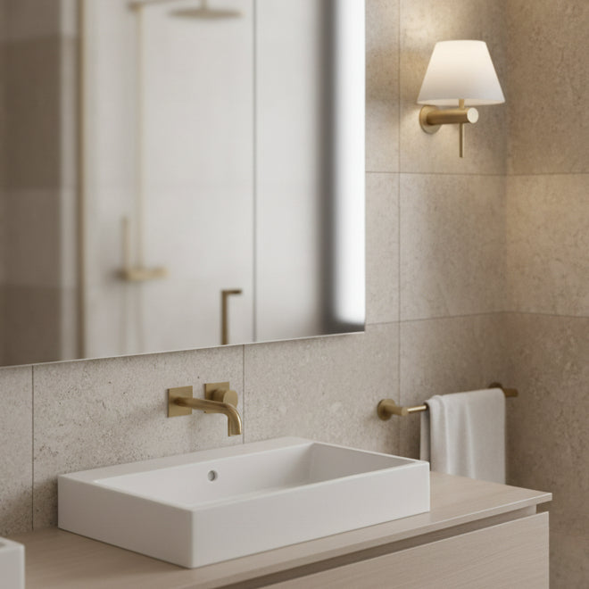 Bathroom with a rectangular white sink, a gold faucet, and a gold towel rack with a white towel