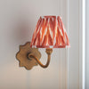 Anvil Curve Wall Light in Brass with Apricot Orange 16cm Zigzag Shade