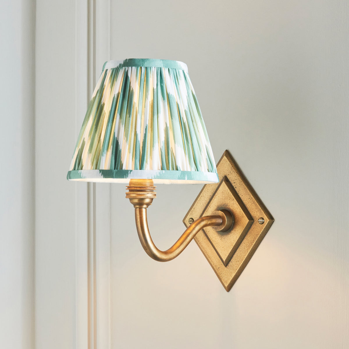 Diamond Curve Wall Light in Brass with Cotswold Green 16cm Zigzag Shade