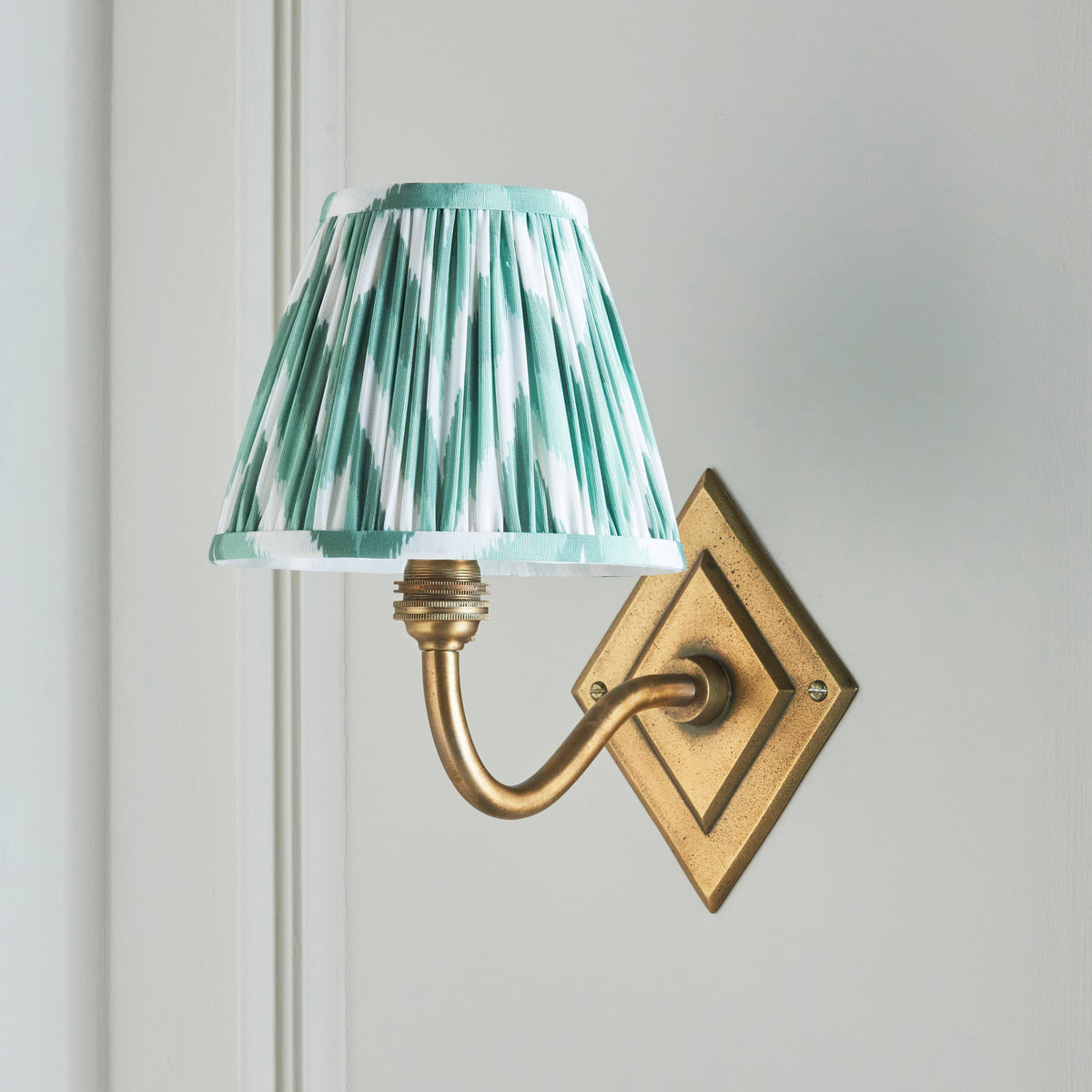 Diamond Curve Wall Light in Brass with Cotswold Green 16cm Zigzag Shade