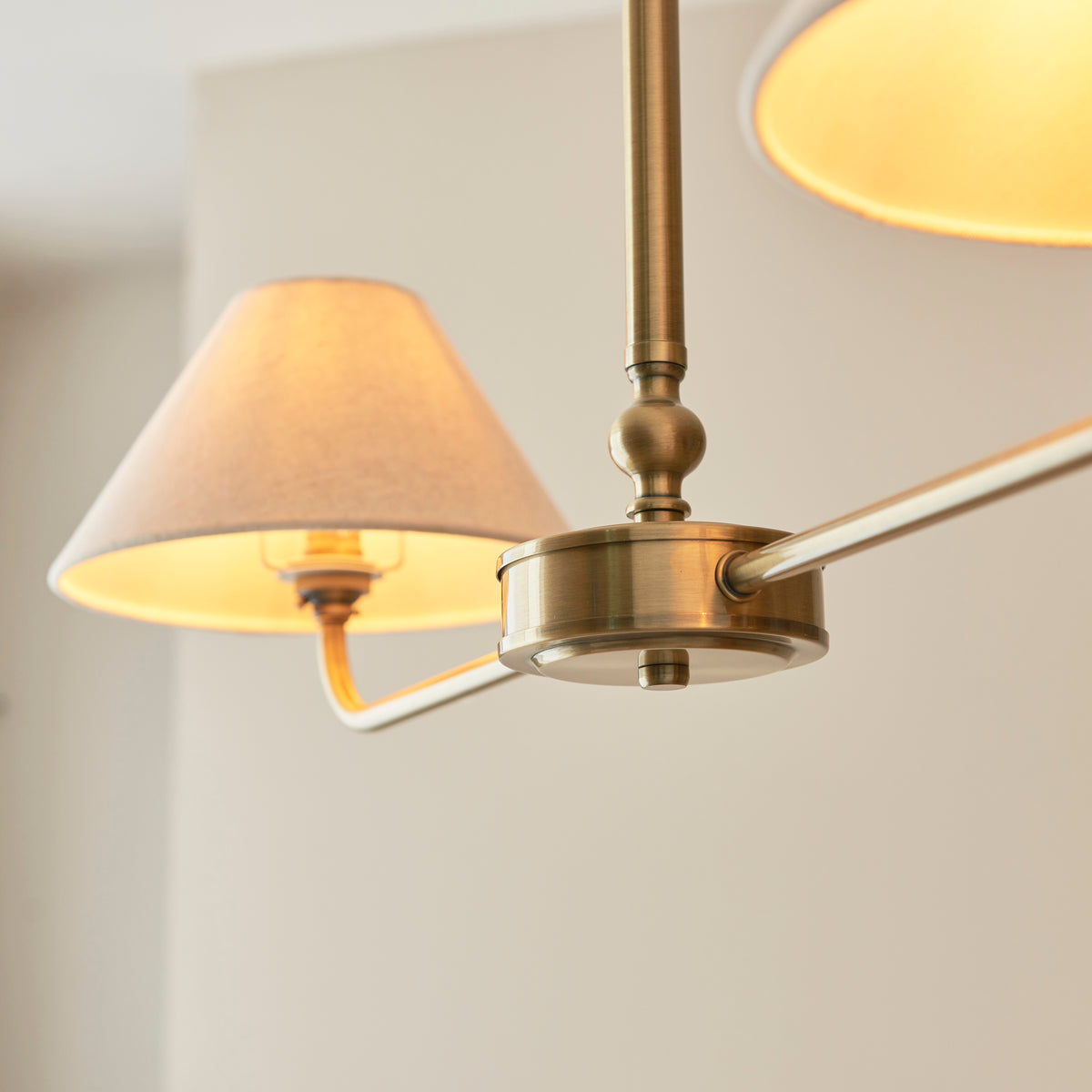 Lille Twin Light Linear Pendant in Antique Brass with Tapered Natural Linen Shades