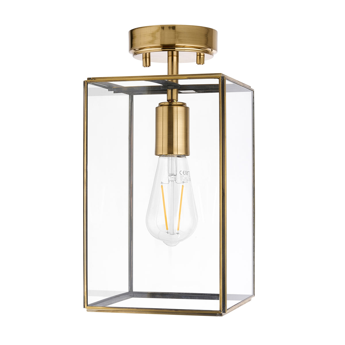 Brass and glass rectangular ceiling light with an exposed filament bulb.
