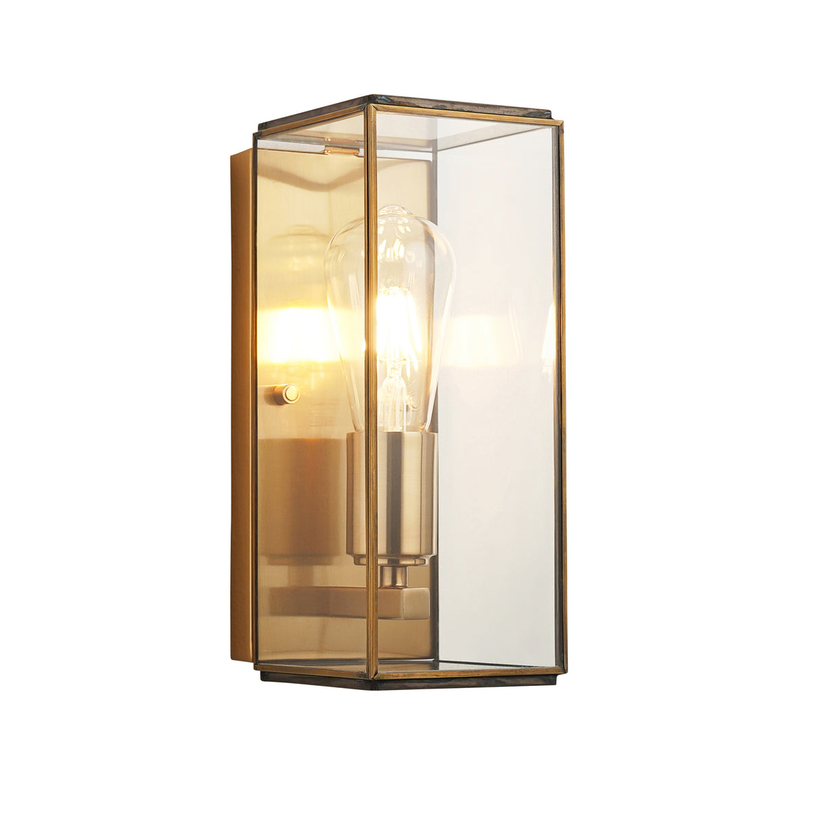 Rectangular brass wall sconce with clear glass panels and an exposed Edison bulb.