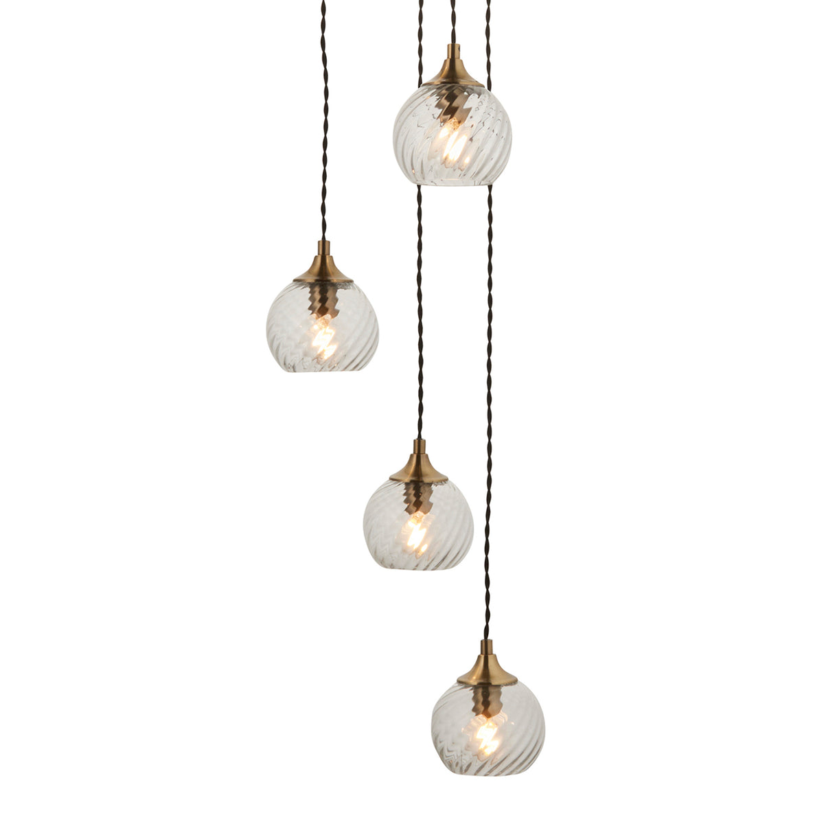 Four clear glass pendant lights with brass fittings hang at varying lengths against a white background.