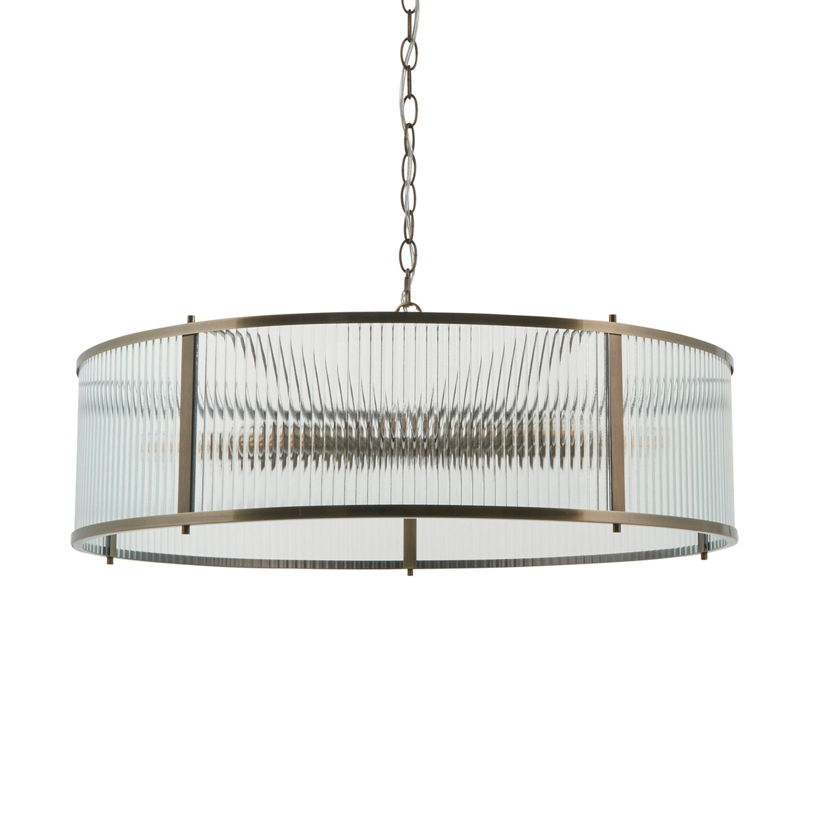 Round chandelier with fluted glass shade and antique brass frame, hanging from a chain.