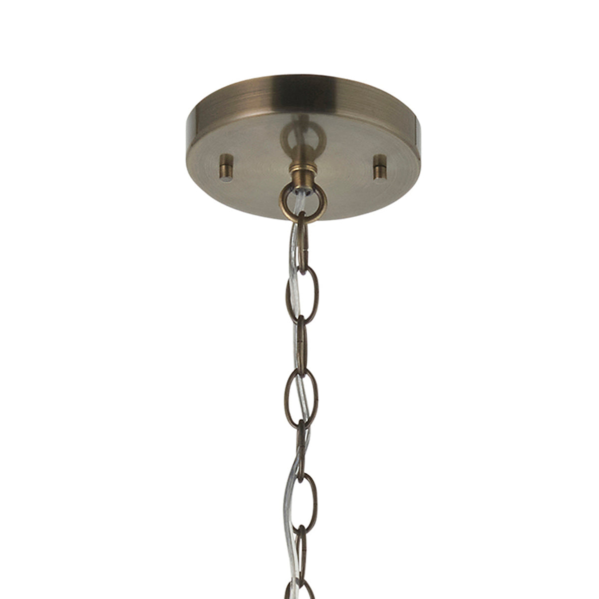Close-up of a bronze ceiling plate with a chain hanging from it.