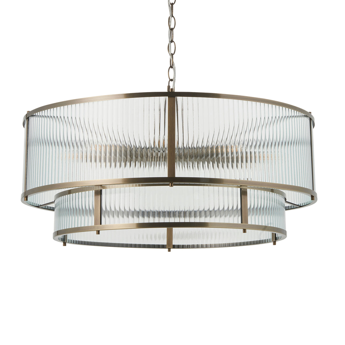 Two-tiered chandelier with fluted glass shades and an antique brass frame, hanging from a chain.