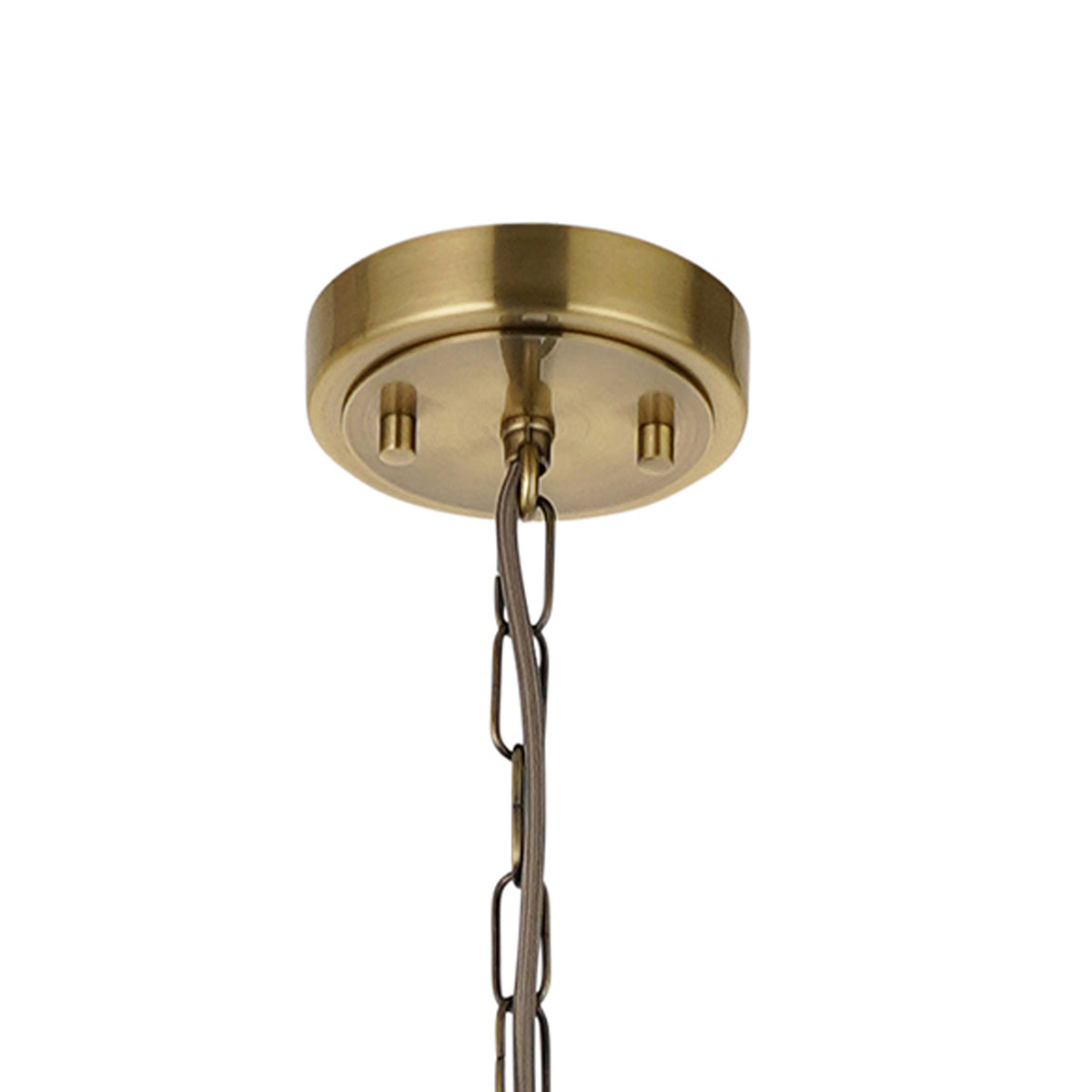 Close-up of a brass ceiling canopy with a chain hanging down, against a white background.