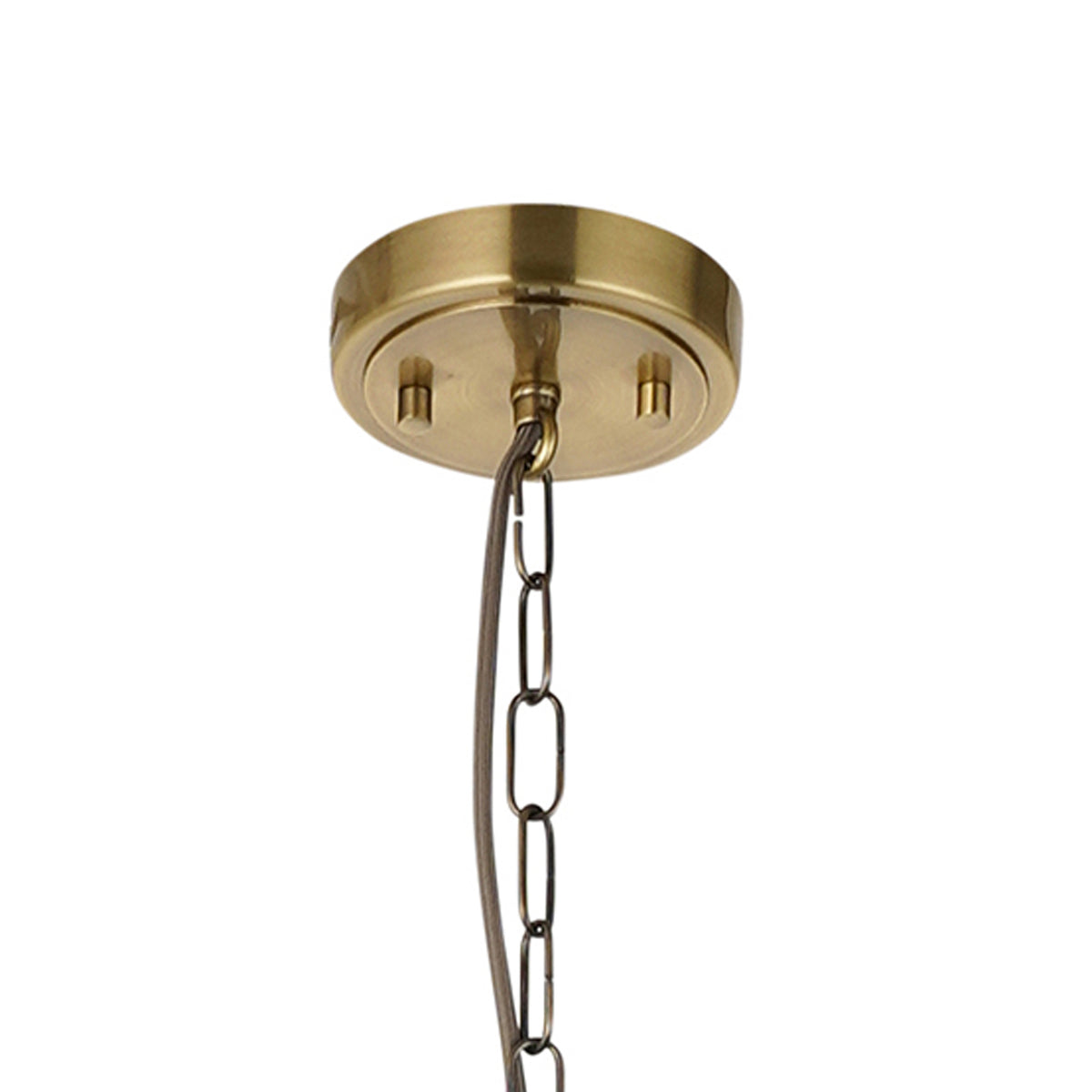Close-up of a brass ceiling canopy with a chain and electrical wire hanging down.