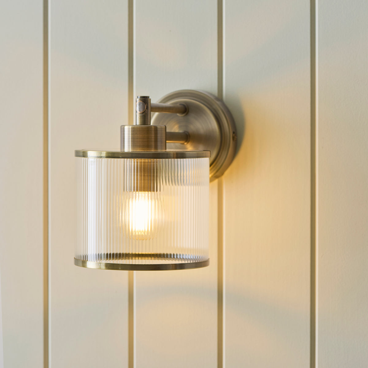 Ridgeton Single Arm Wall Light in Antique Brass & Clear Ribbed Glass