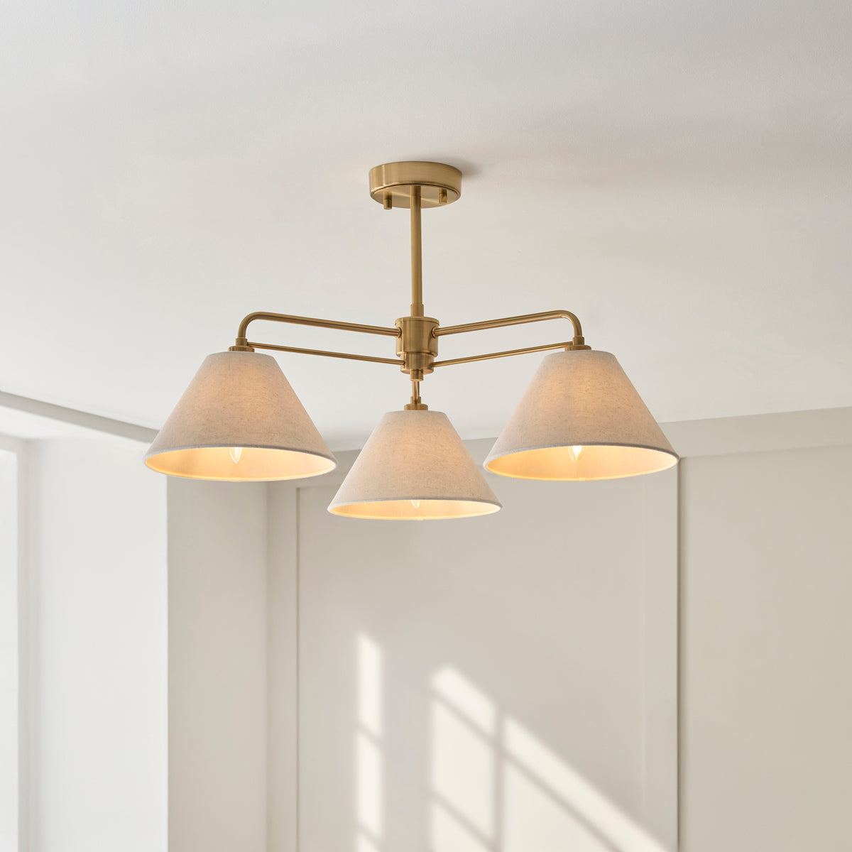 Wallbridge Three Arm Ceiling Light in Brushed Aged Brass with Natural Linen Shades