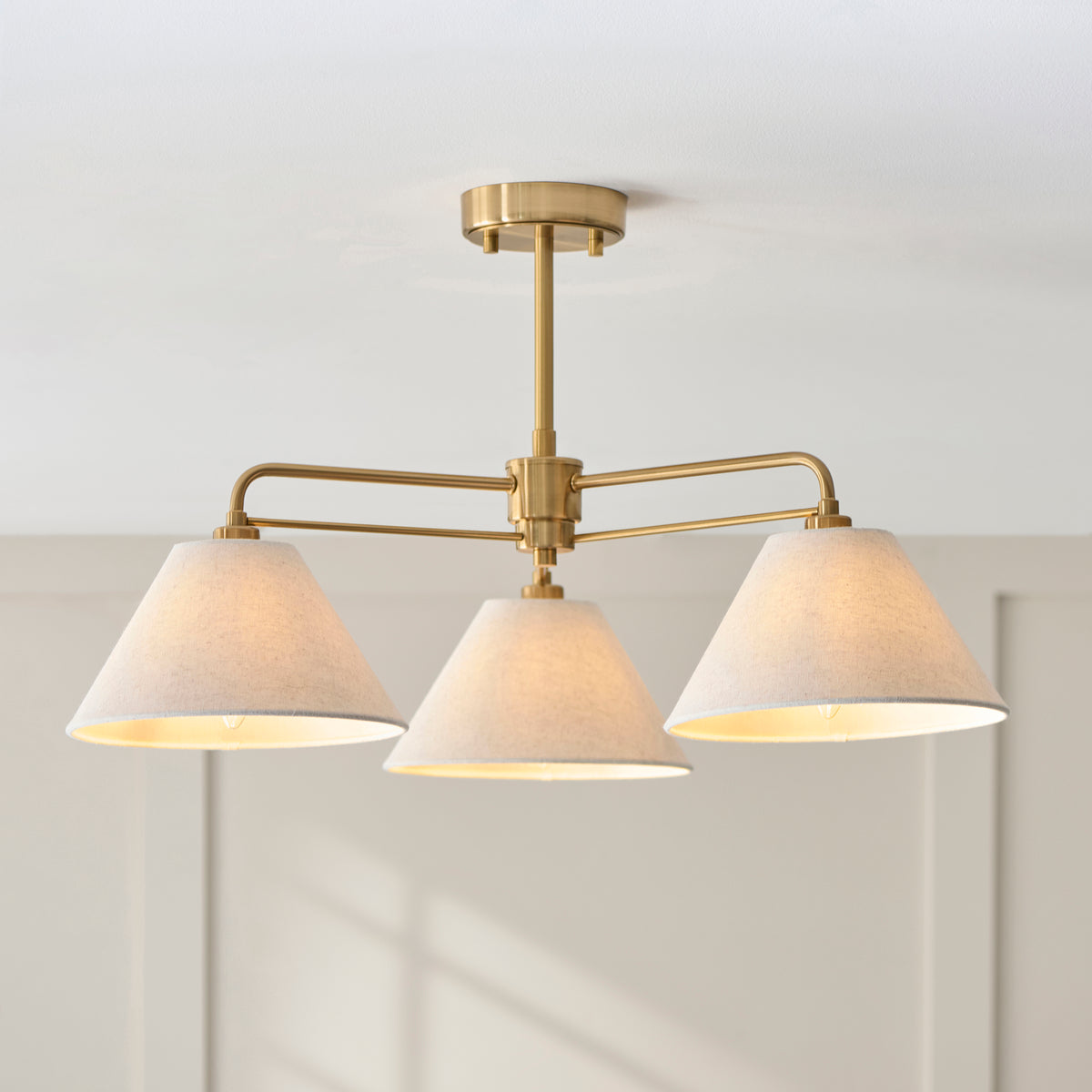 Wallbridge Three Arm Ceiling Light in Brushed Aged Brass with Natural Linen Shades