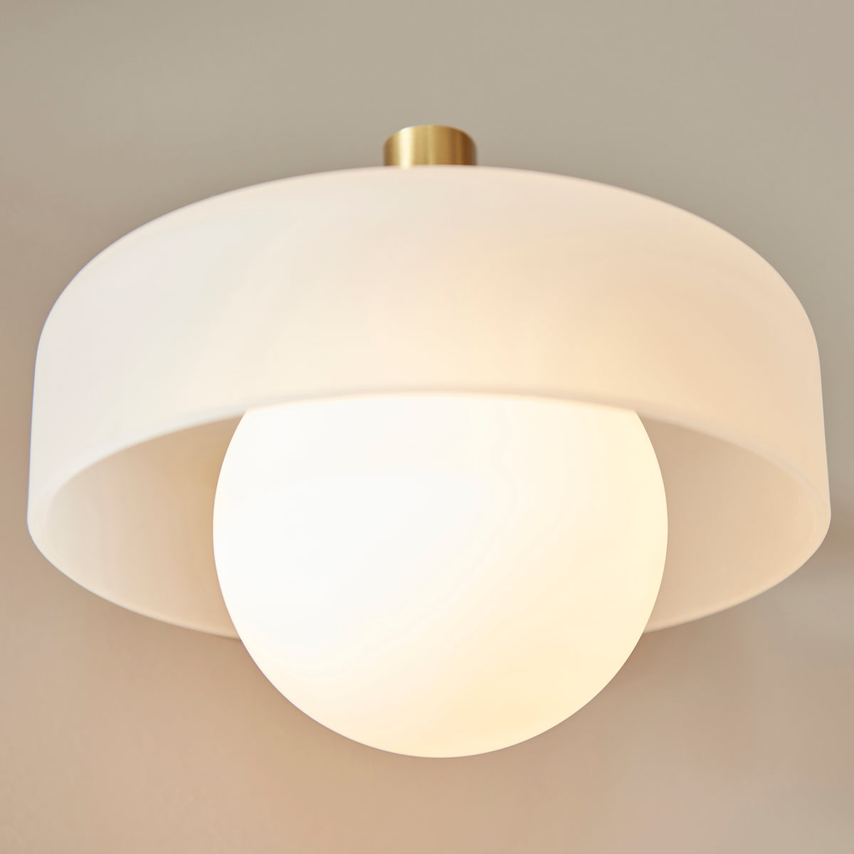 Endon Lighting Boss wall light in brushed aged brass with a matt opal sphere glass shade