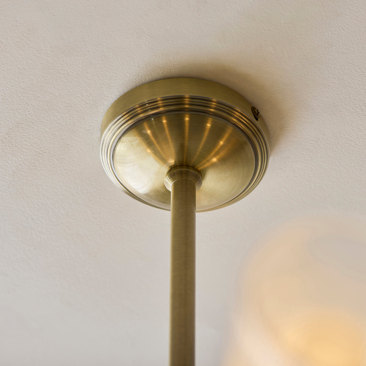 Avelyn Eight Arm Pendant in Antique Brass & Frosted Glass Diffusers