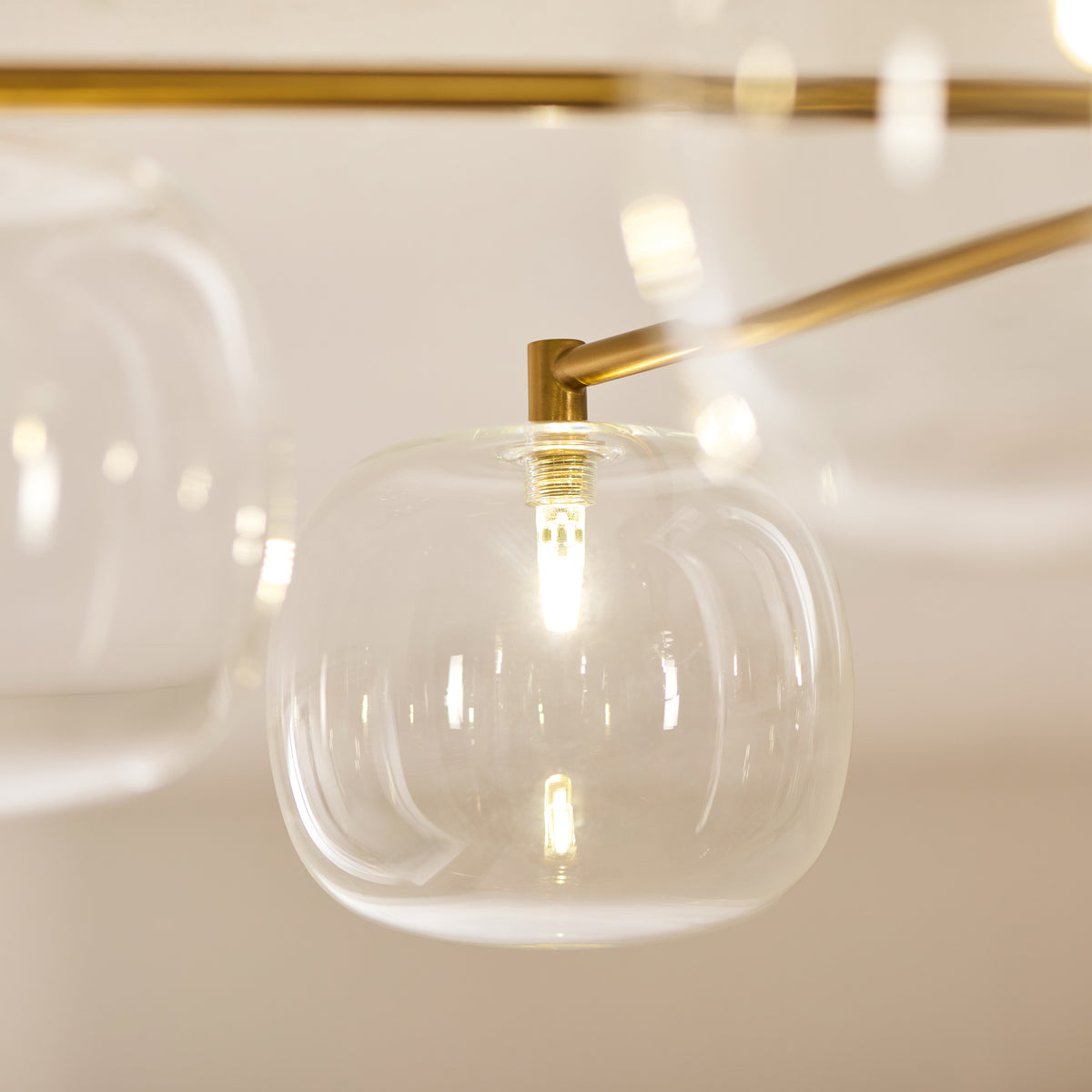 Oslo Six Arm Semi Flush Ceiling Light in Brushed Aged Brass with Clear Glass Shades