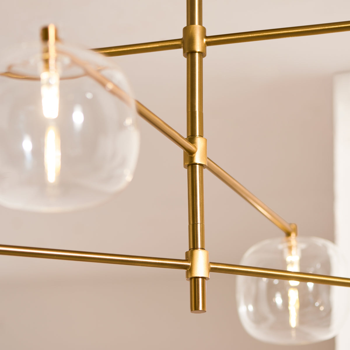 Oslo Six Light Pendant in Brushed Aged Brass with Clear Glass Shades