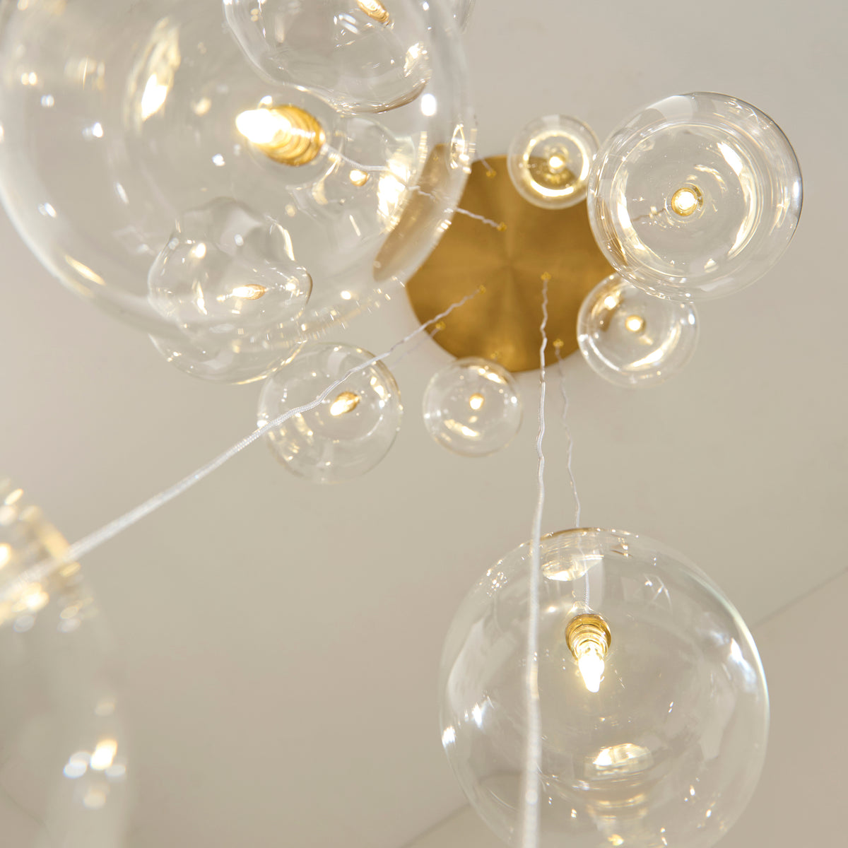 Oslo Twelve Light Cluster Pendant in Brushed Aged Brass with Clear Glass Shades
