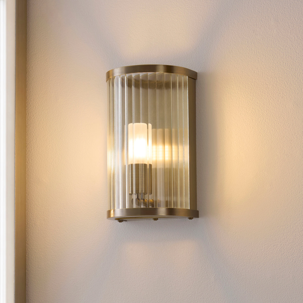 Ridgeton IP44 Wall Light in Antique Brass with Clear Ribbed Glass