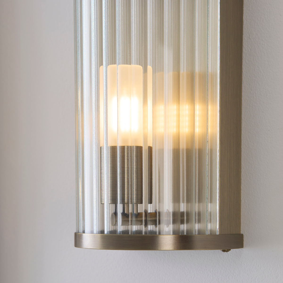 Ridgeton IP44 Wall Light in Antique Brass with Clear Ribbed Glass