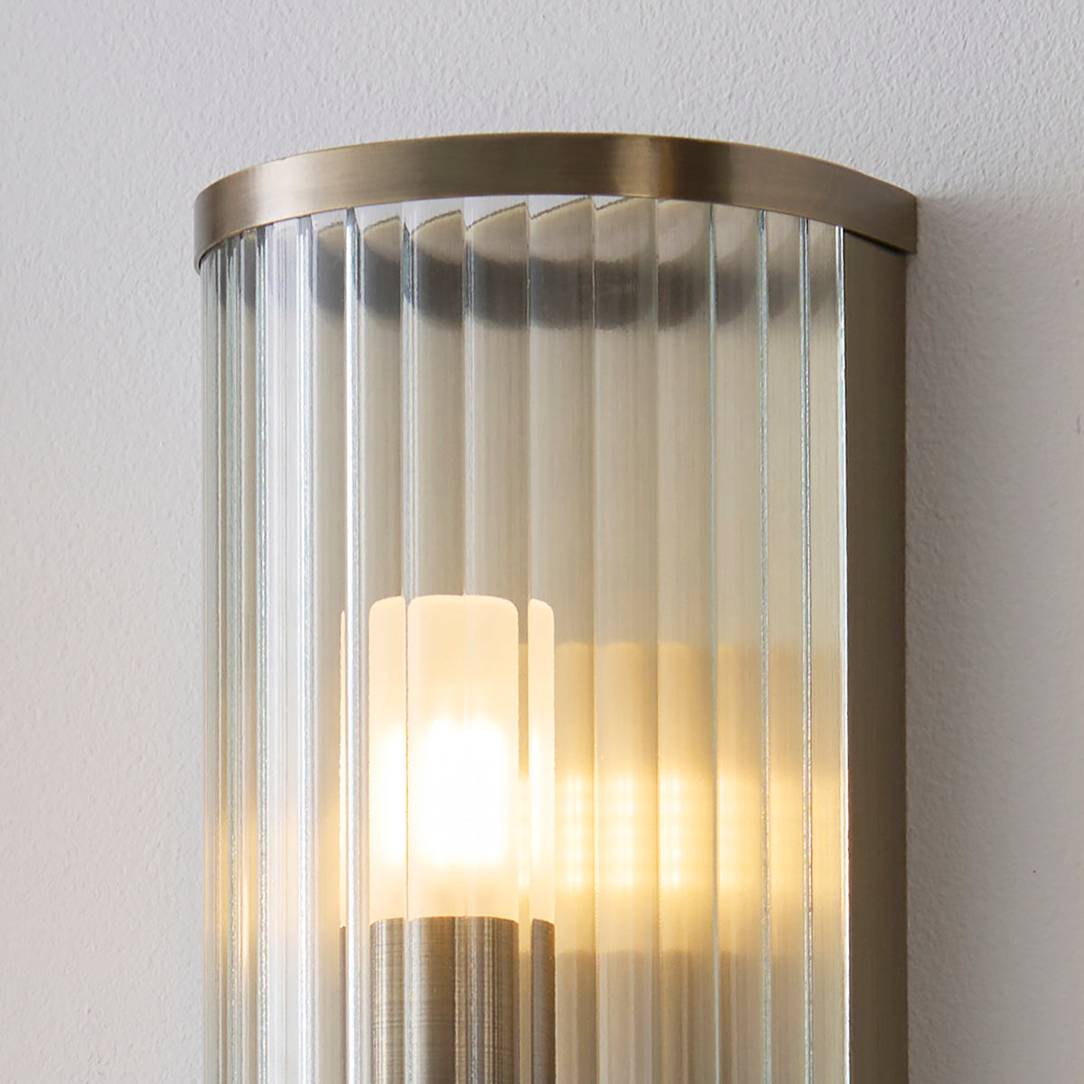 Ridgeton IP44 Wall Light in Antique Brass with Clear Ribbed Glass