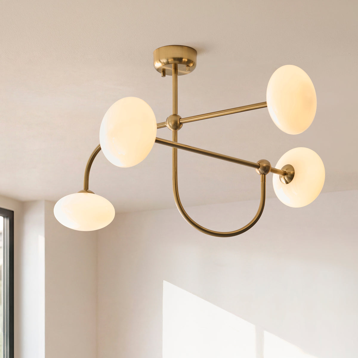 Ottowa Four Light Semi Flush in Brushed Aged Brass with Opal Glass Shades