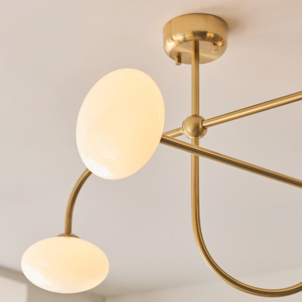 Ottowa Four Light Semi Flush in Brushed Aged Brass with Opal Glass Shades