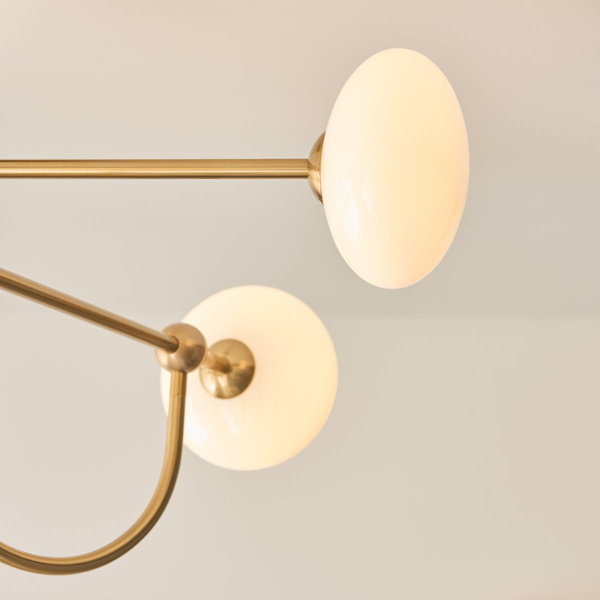Ottowa Four Light Semi Flush in Brushed Aged Brass with Opal Glass Shades