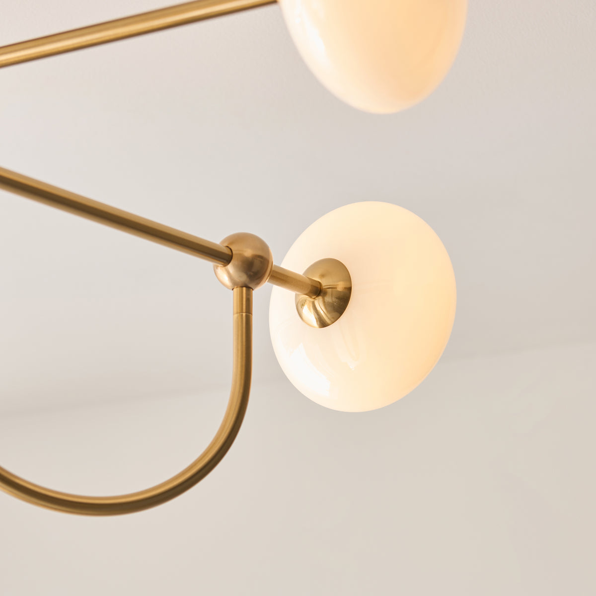 Ottowa Four Light Semi Flush in Brushed Aged Brass with Opal Glass Shades