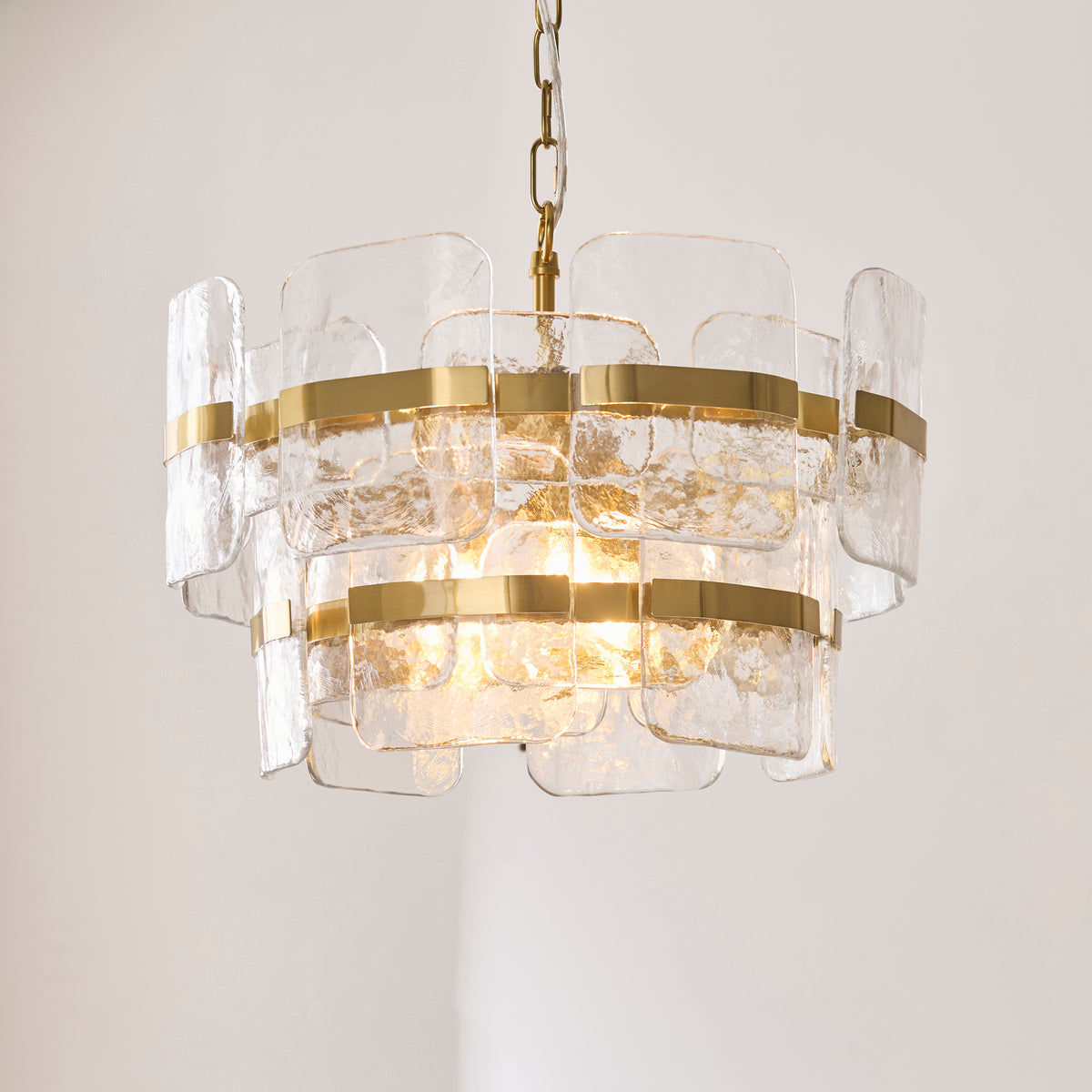 Ancara Three Light Pendant in Brushed Aged Brass with Clear Textured Glass Panels
