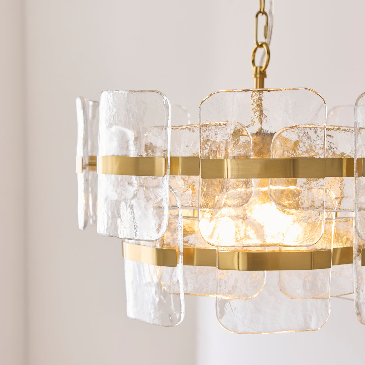 Ancara Three Light Pendant in Brushed Aged Brass with Clear Textured Glass Panels