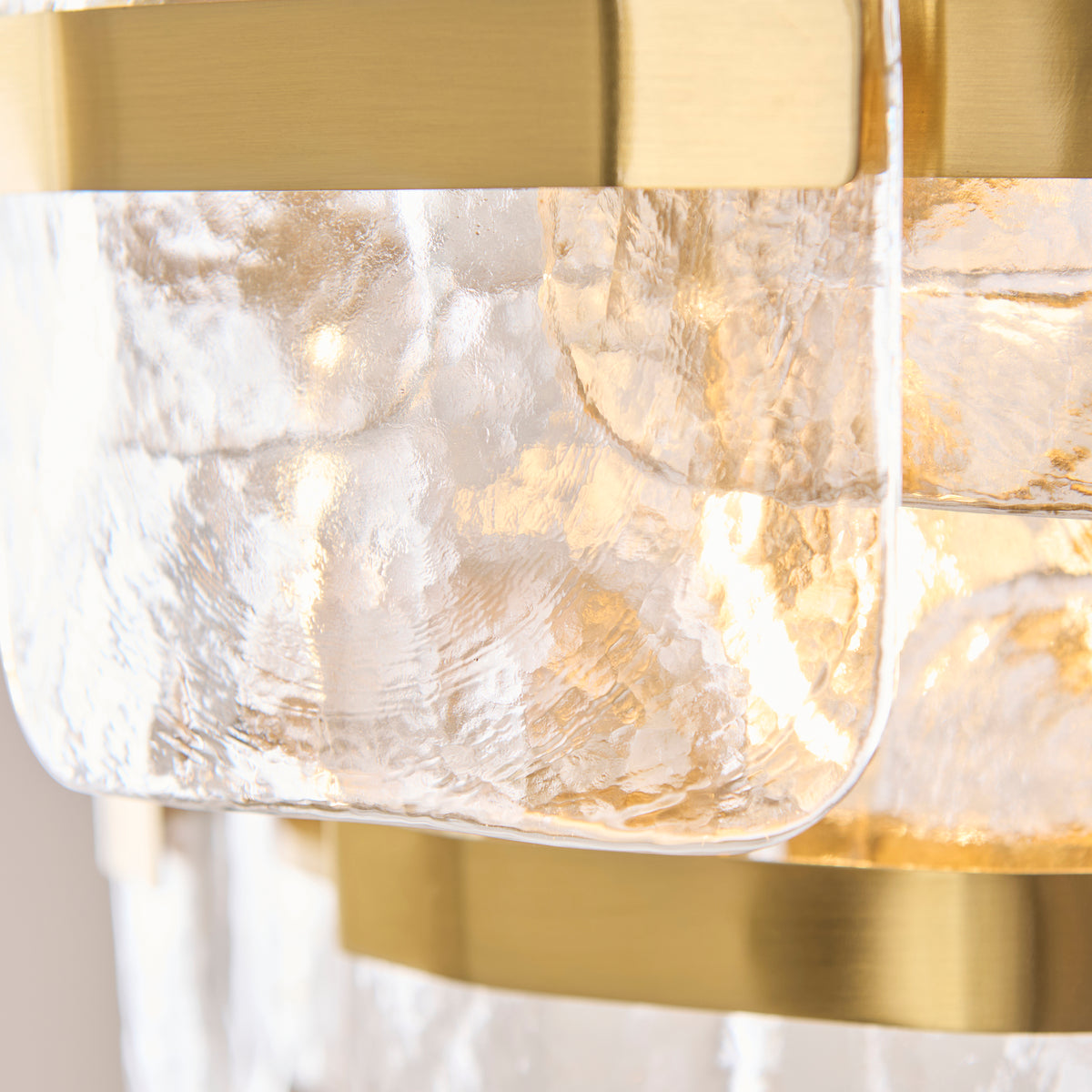 Ancara Three Light Pendant in Brushed Aged Brass with Clear Textured Glass Panels