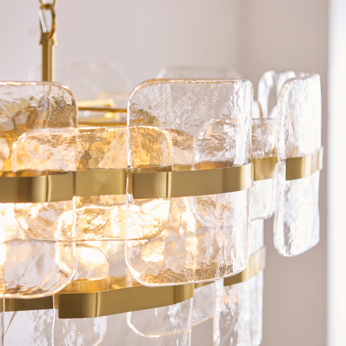 Ancara Six Light Pendant in Brushed Aged Brass with Clear Textured Glass Panels