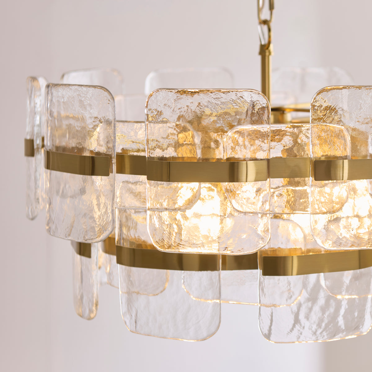 Ancara Six Light Pendant in Brushed Aged Brass with Clear Textured Glass Panels