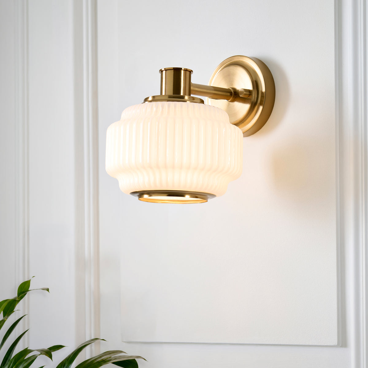 Evora Wall Light in Brushed Aged Brass with Gloss Opal Ribbed Glass