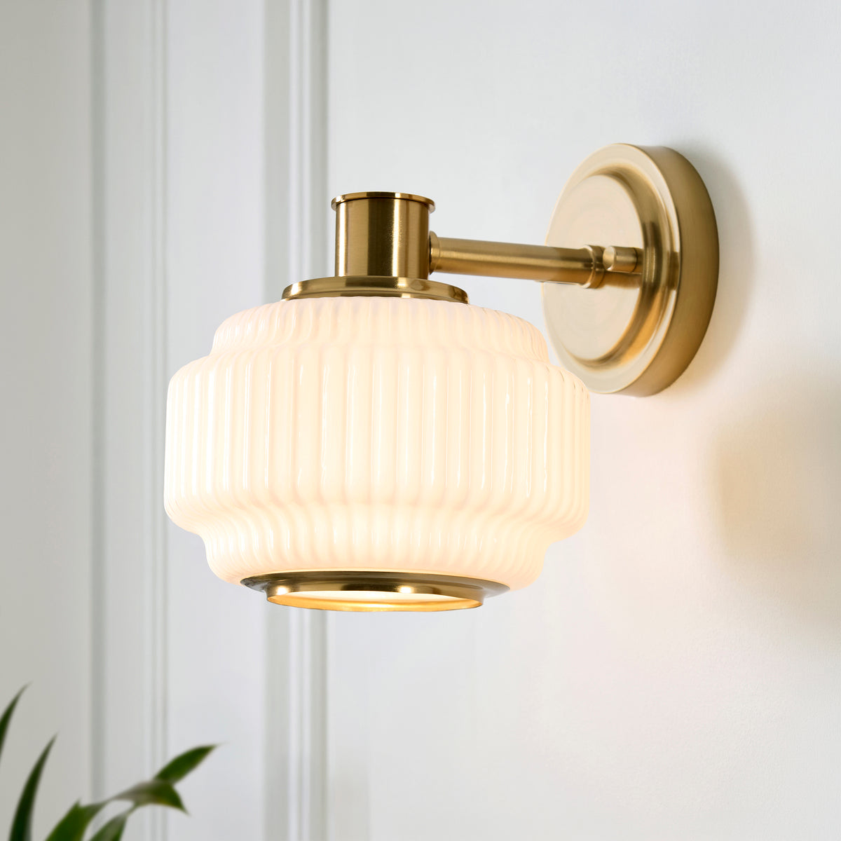 Evora Wall Light in Brushed Aged Brass with Gloss Opal Ribbed Glass
