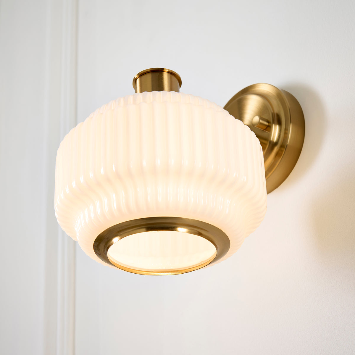 Evora Wall Light in Brushed Aged Brass with Gloss Opal Ribbed Glass