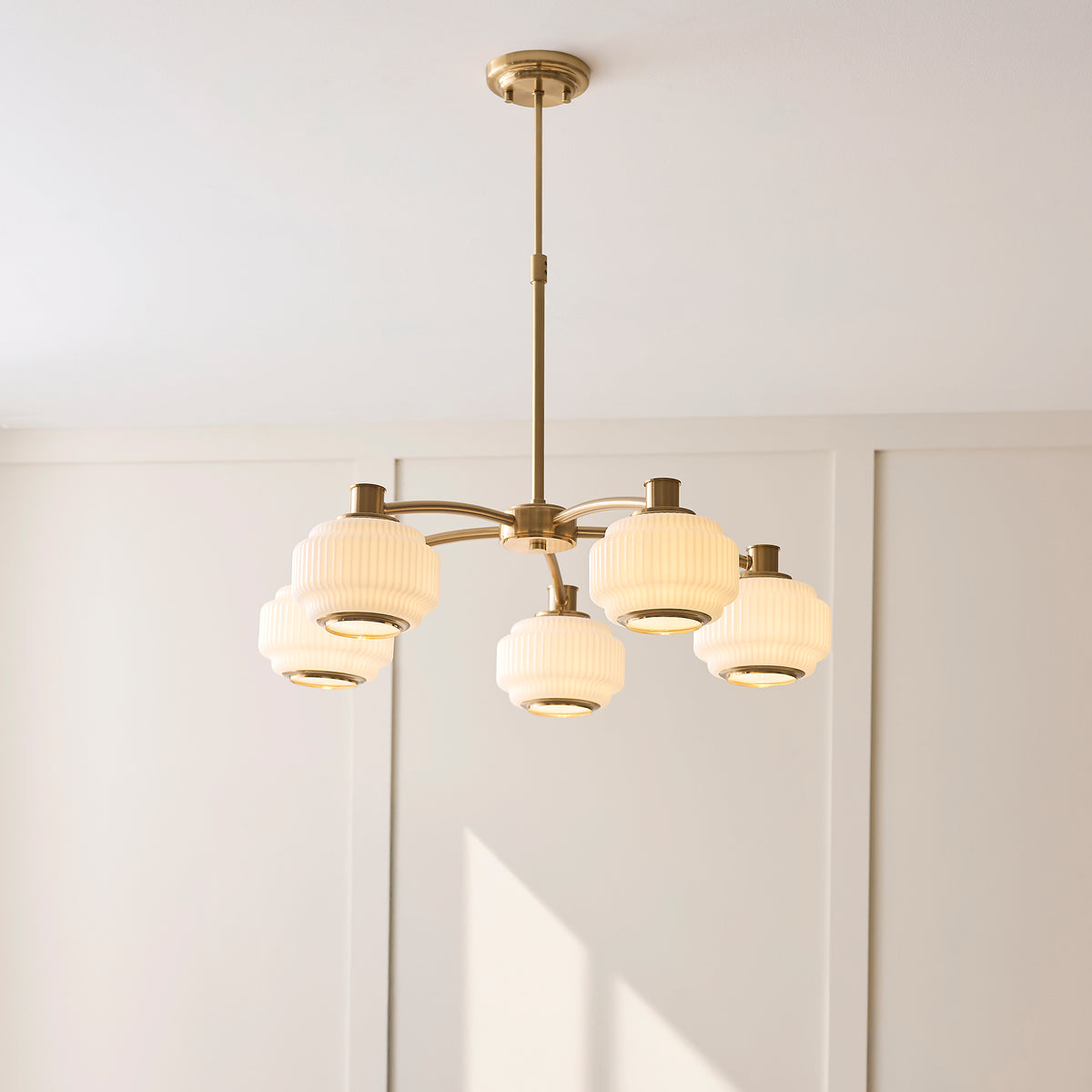 Evora Five Arm Pendant in Brushed Aged Brass with Gloss Opal Ribbed Glass Shades