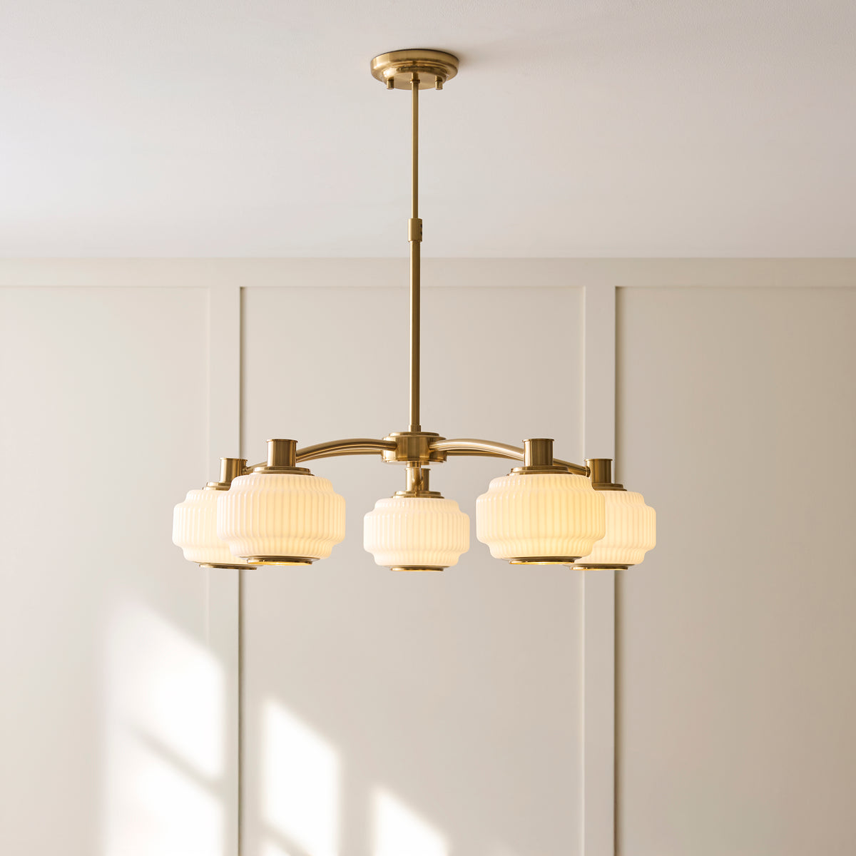 Evora Five Arm Pendant in Brushed Aged Brass with Gloss Opal Ribbed Glass Shades