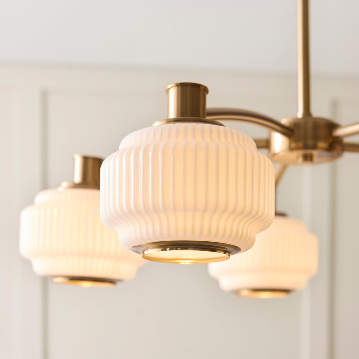 Evora Five Arm Pendant in Brushed Aged Brass with Gloss Opal Ribbed Glass Shades