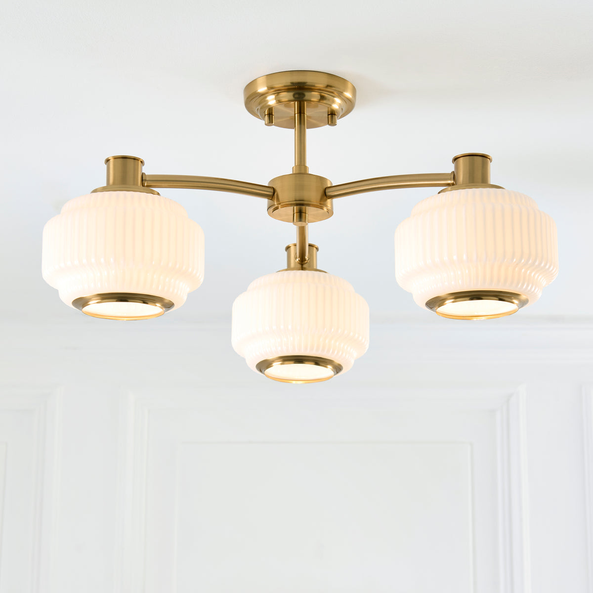 Evora Three Arm Semi Flush in Brushed Aged Brass with Gloss Opal Ribbed Glass Shades