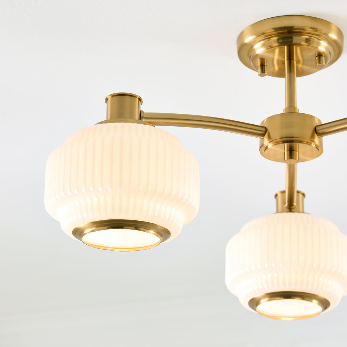 Evora Three Arm Semi Flush in Brushed Aged Brass with Gloss Opal Ribbed Glass Shades