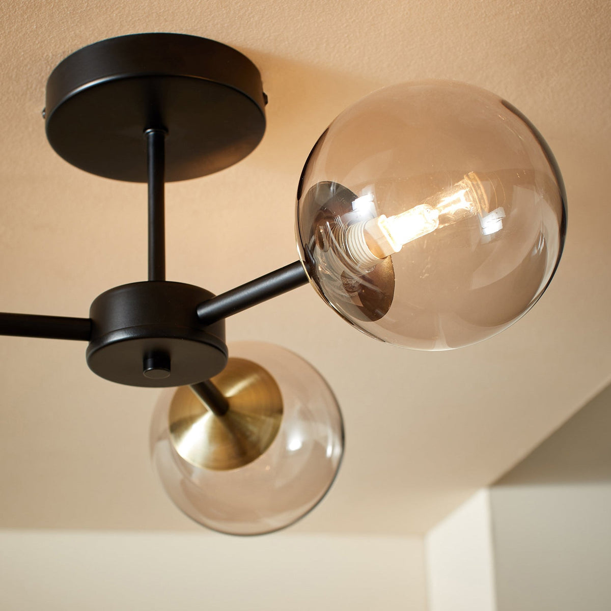 Globe 3 Light Semi Flush Ceiling Light in Matt Black & Antique Brass with Tinted Grey Glass Shades