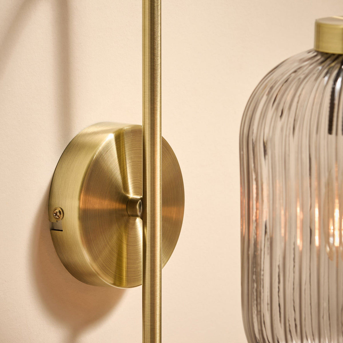 Briz Wall Light in Antique Brass with Ribbed Grey Glass Shade