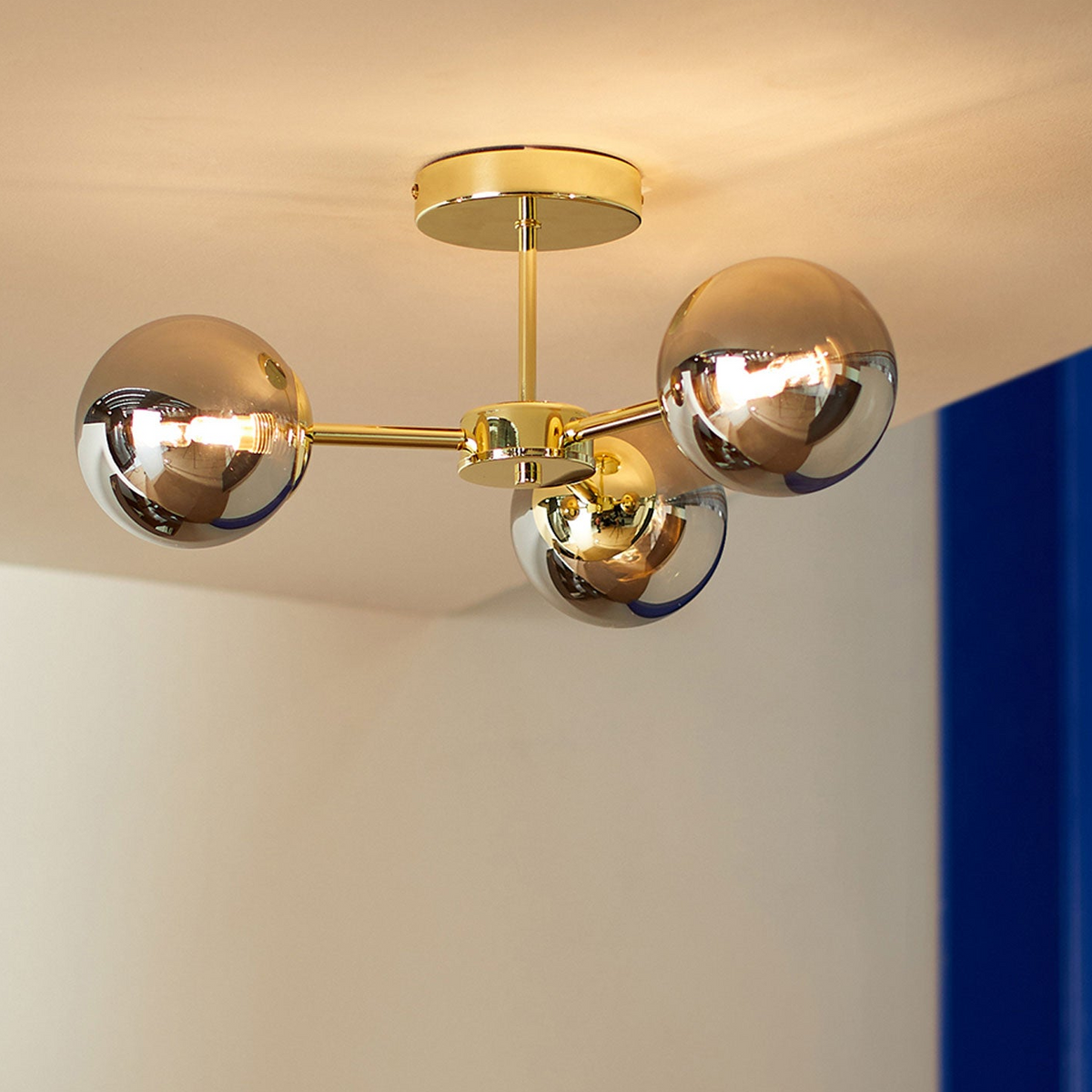 Globe 3 Light Semi Flush Ceiling Light in Polished Brass with Smoked Glass Shades