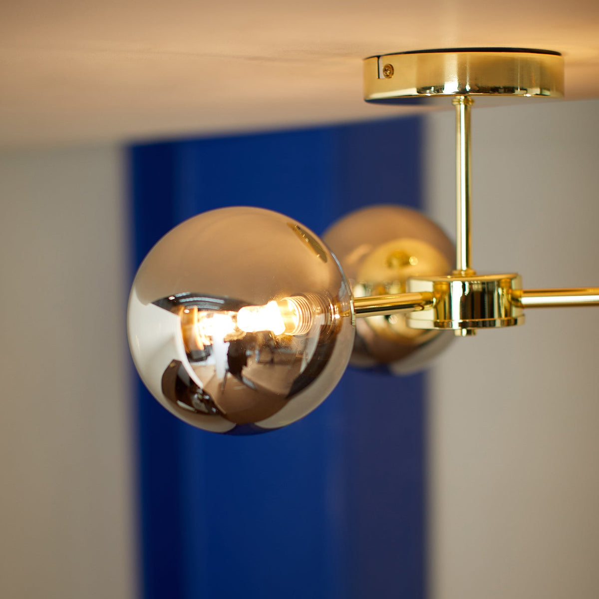 Globe 3 Light Semi Flush Ceiling Light in Polished Brass with Smoked Glass Shades