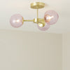 Globe 3 Light Semi Flush Ceiling Light in Brushed Brass with Pink Glass Shades