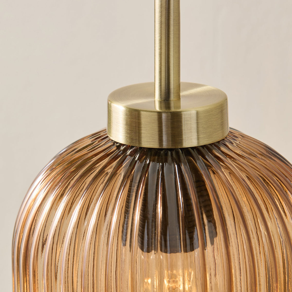 Briz Wall Light in Antique Brass with Ribbed Amber Brown Glass Shade
