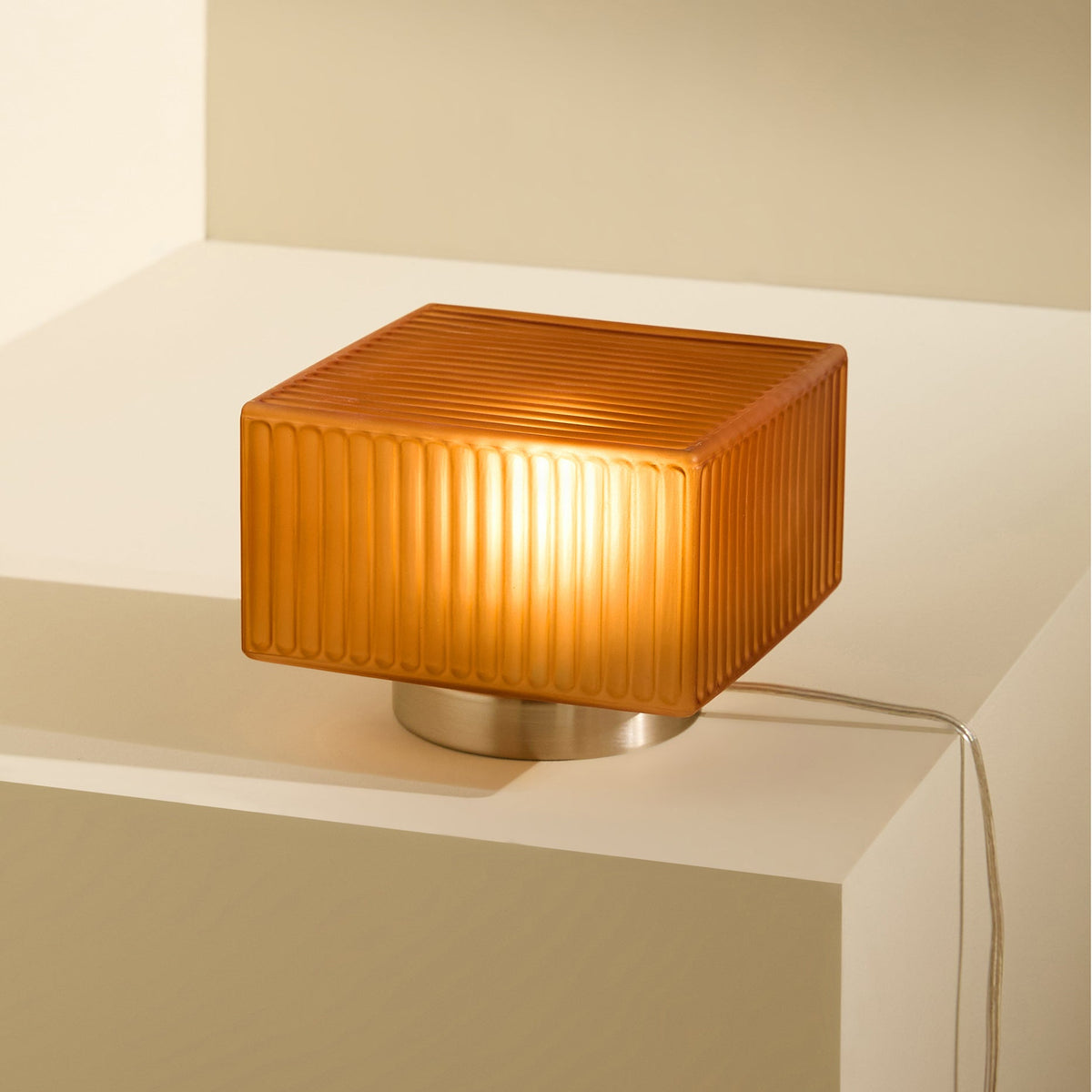 Alma Table Lamp in Brushed Chrome with Amber Brown Glass Shade