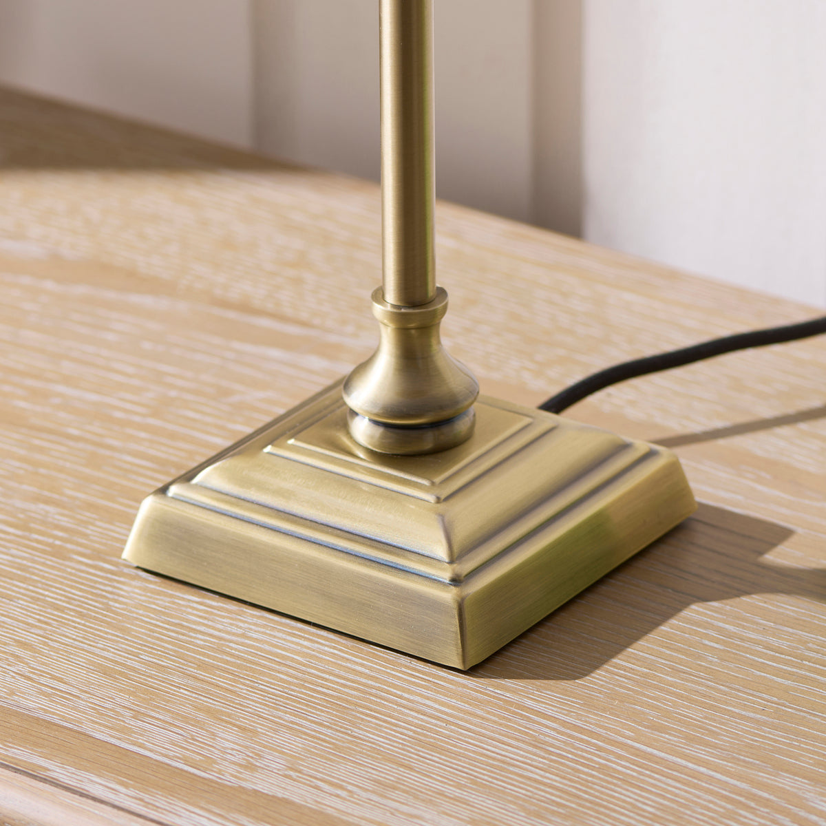 Jericho Table Lamp in Antique Brass with Warm Brown Rattan Shade