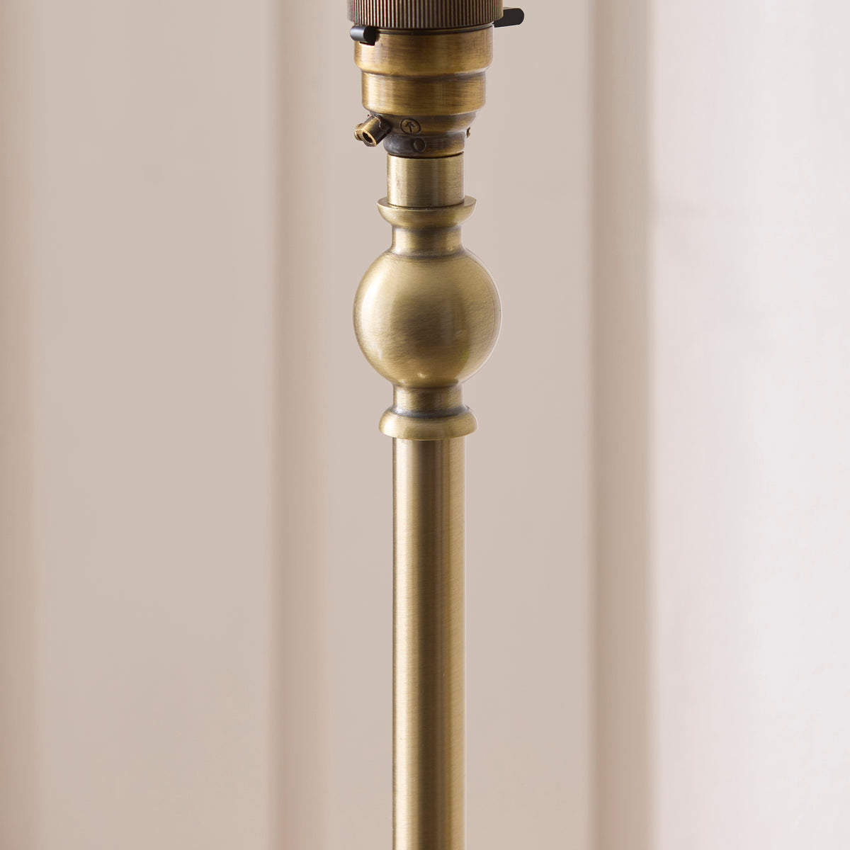 Jericho Floor Lamp in Antique Brass with Warm Brown Rattan Shade